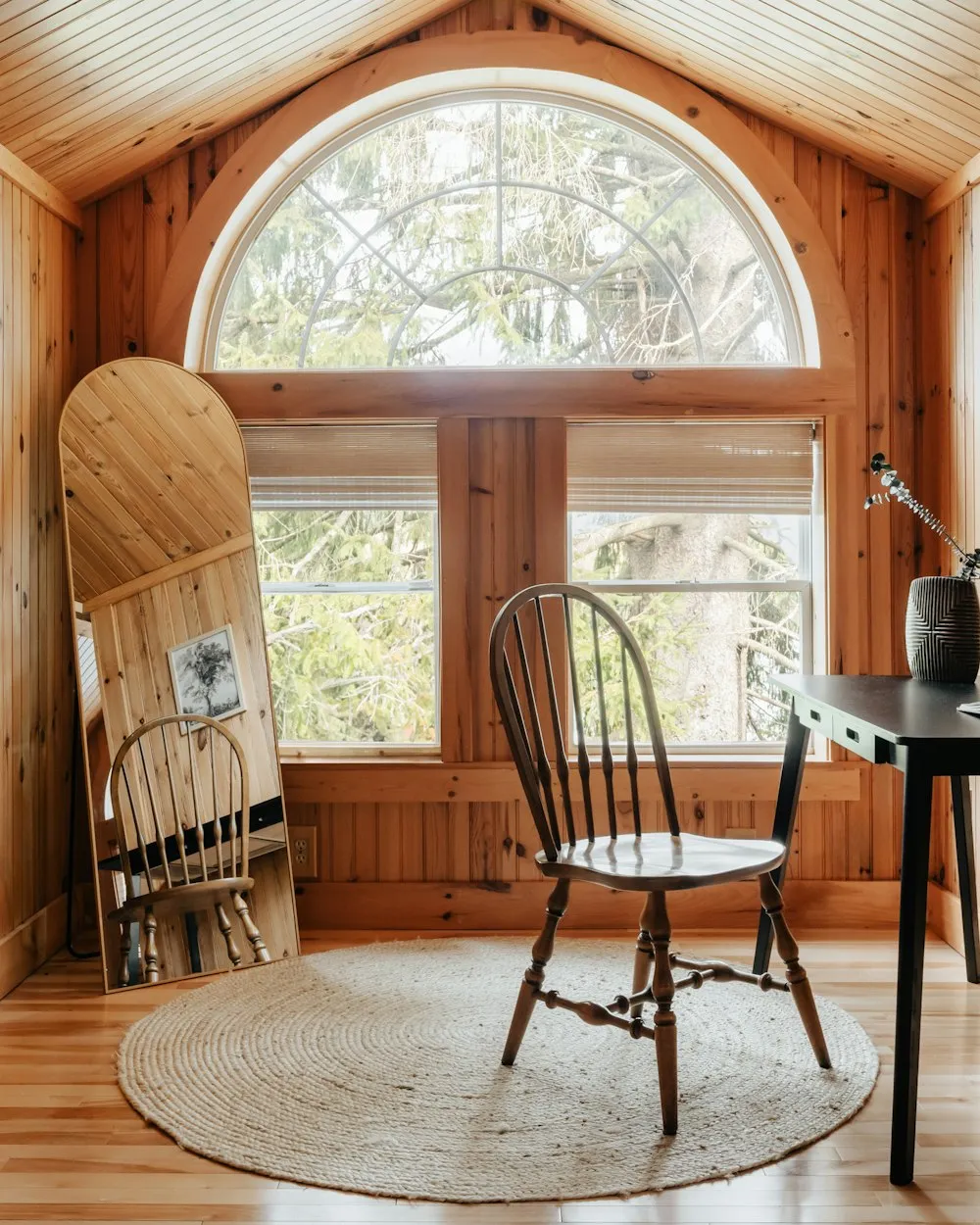 A warm, naturally lit room with a window and chair